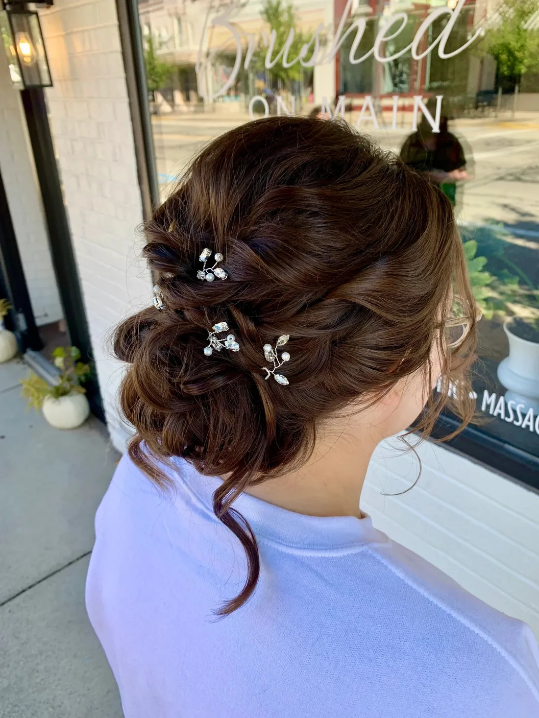 Brunette bridal updo with pearl pins