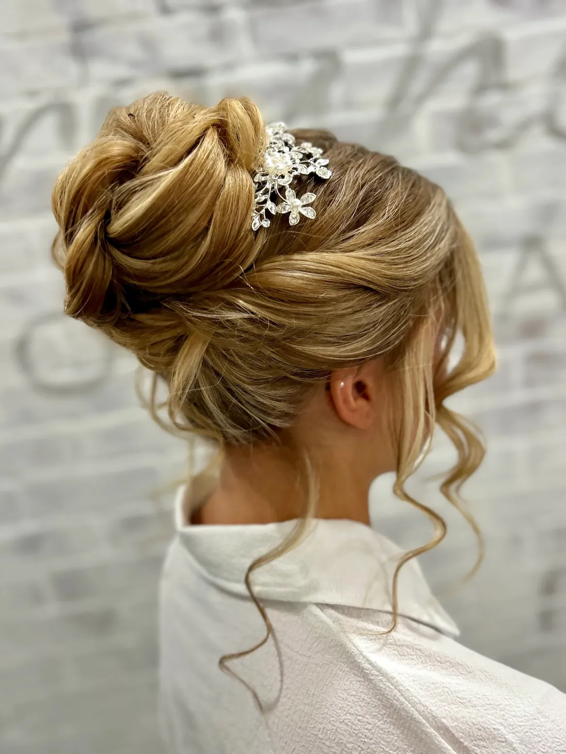 High blonde bridal bun with crystal comb